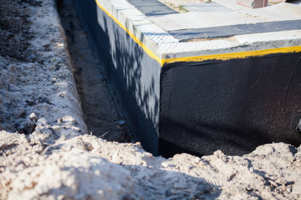 Professional Emergency Waterproofing technician working in Burlington, KY